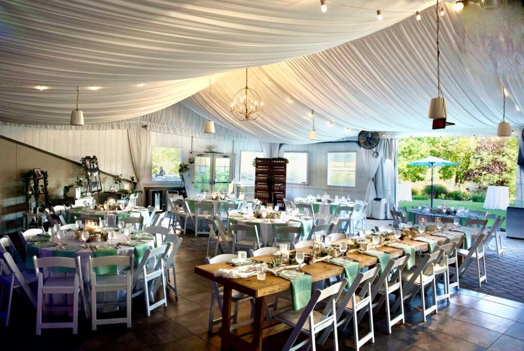 Spacious South Jersey wedding venue ballroom set for reception with floral centerpieces