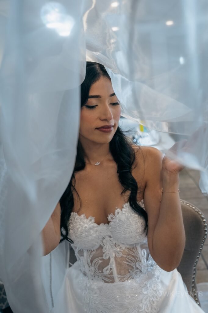 Bride during bridal prep in bridal suite